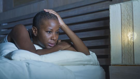 A stressed woman in bed