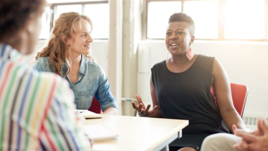 Woman speaking in meeting