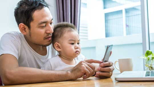 Dad with son and phone