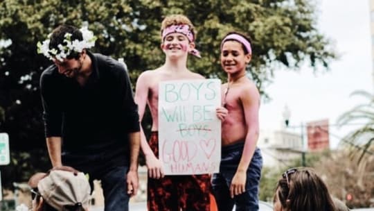 women at the Women's March holding signs