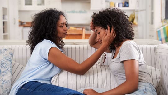 Mom comforting daughter