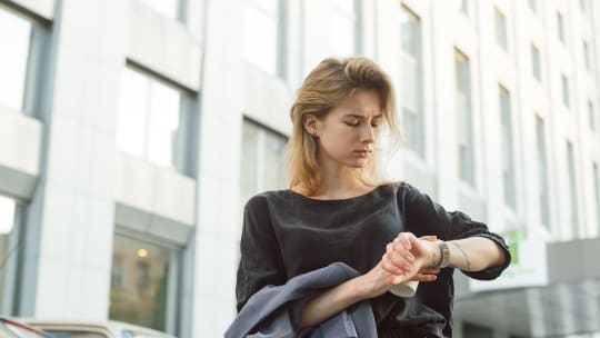 woman holding clock