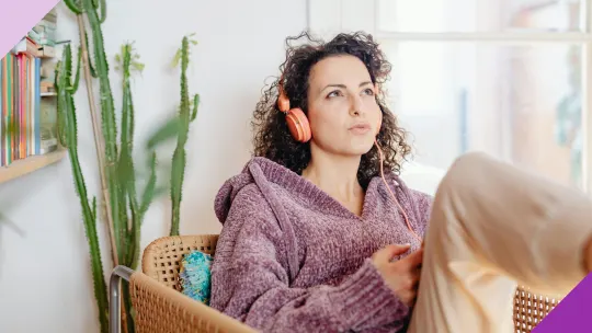 Woman listening to a finance podcast