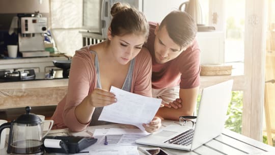 Couple looking at budget