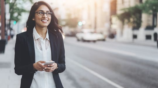 Happy woman walking to work