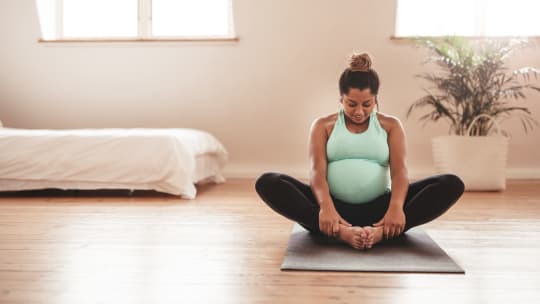 Pregnant woman doing yoga