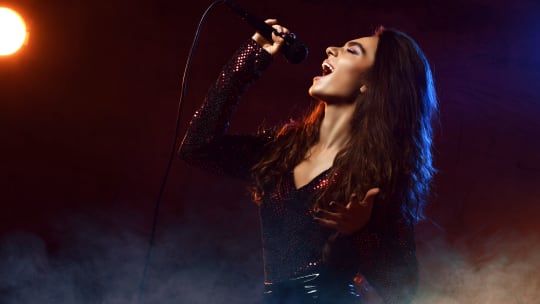 woman with microphone singing
