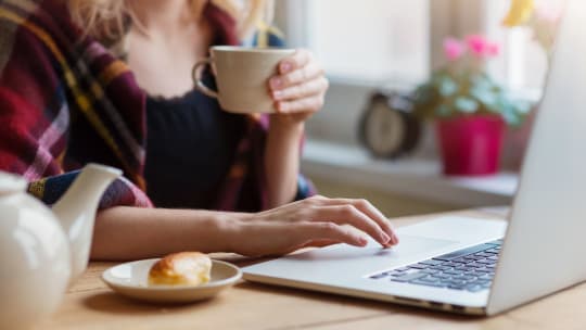 Woman typing on laptop