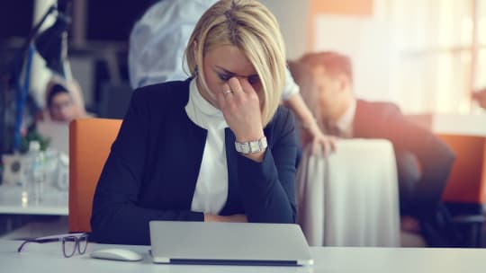 Women tired at desk