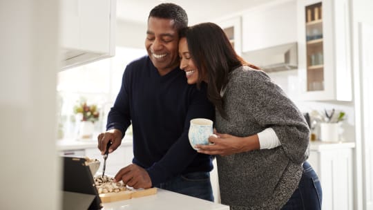 Happy couple cooking