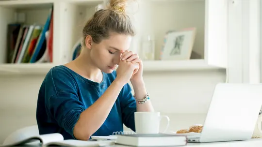 woman at work frustrated in front of her computer
