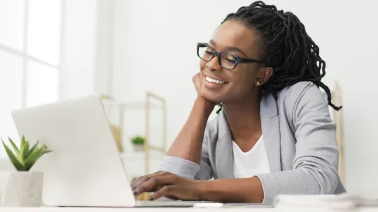 Happy woman on laptop