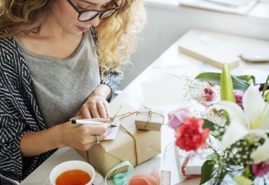 Woman wrapping gift