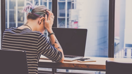 Sad woman on laptop