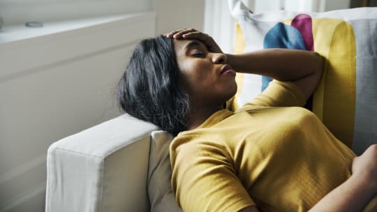 Stressed woman on couch