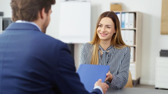 interviewee and interviewers in a meeting