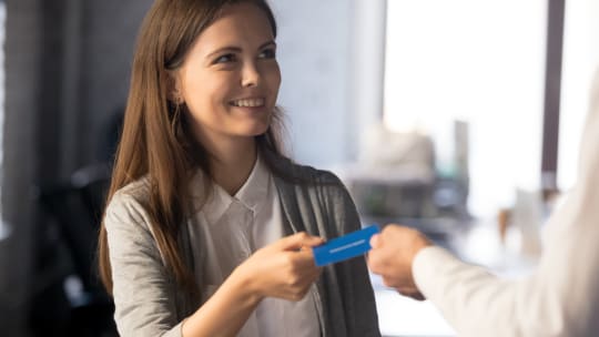 colleagues exchanging business cards