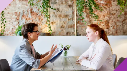 A candidate and recruiter talking, illustrating how to answer “Are you interviewing with other companies?”