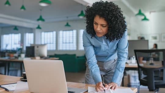 Woman writing in a notebook