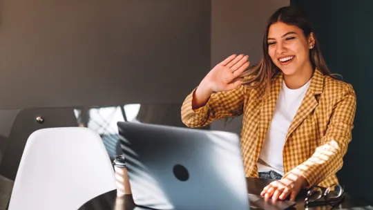 Woman happy on laptop