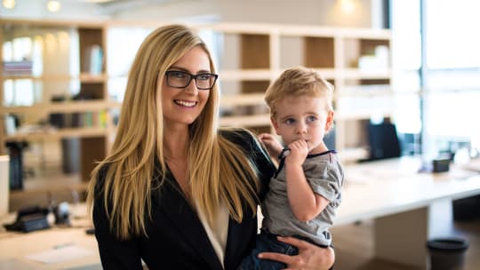 Businesswoman with baby