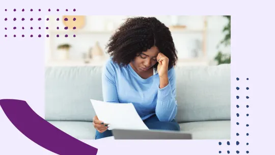 a woman stressed holding documents
