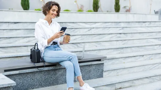 Fashionable business woman sitting outside