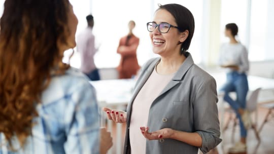 Two professional women talking