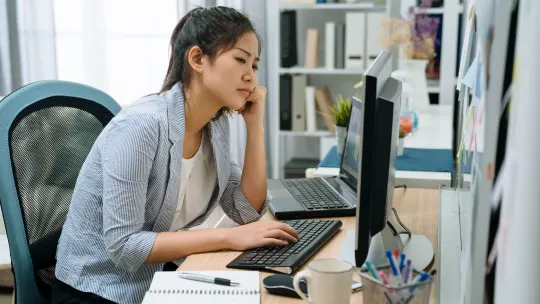 Upset woman on computer