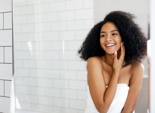 Woman smiling in mirror