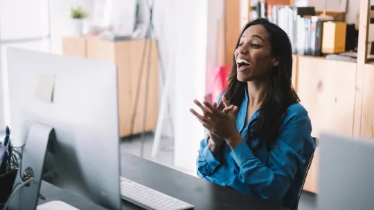 woman laughing on a webinar