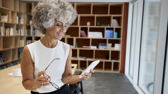 Woman smiling with phone