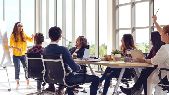 woman presenting at product meeting