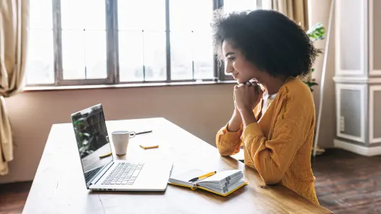 woman typing on laptop