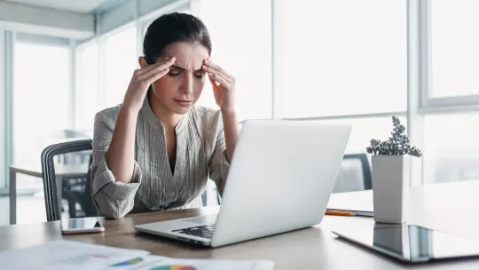 woman frustrated at desk