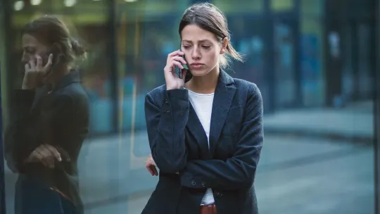 Boss works on cell phone