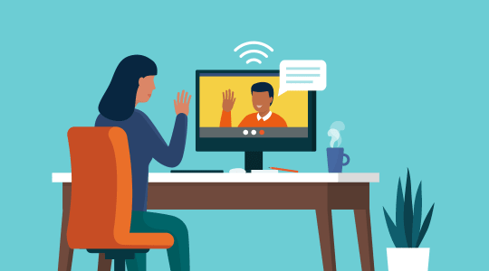 Coworkers talking at desk