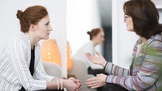 Two women talking