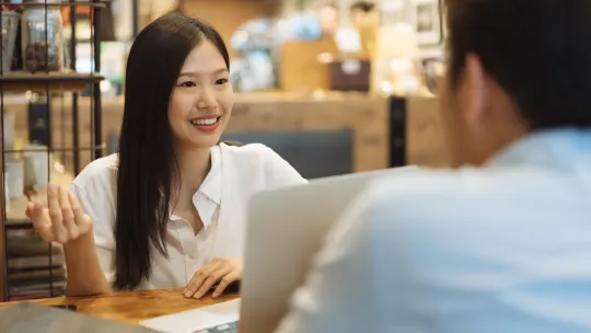 Woman talking to her mentor