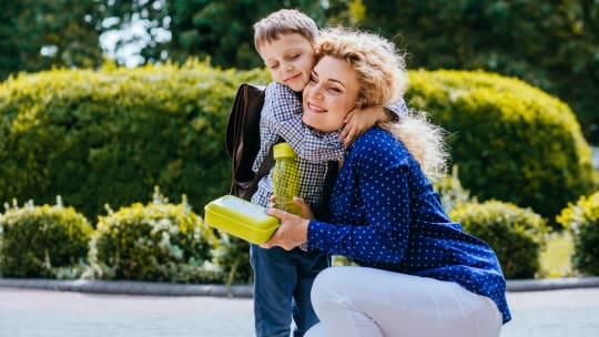 Woman with son before school