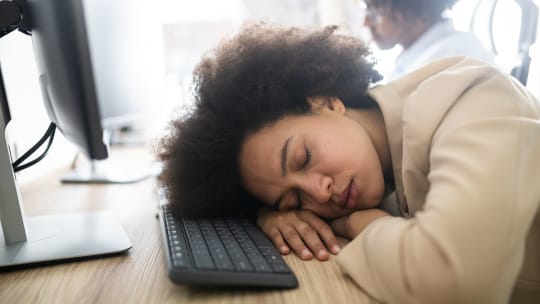 woman sleeping at work