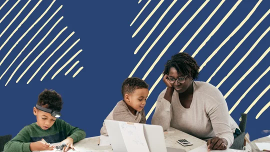 a mom helping her two young boys with homework