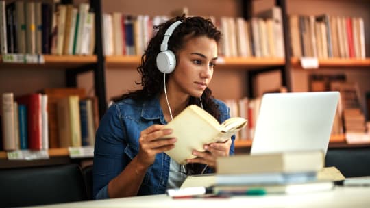 student working in the library