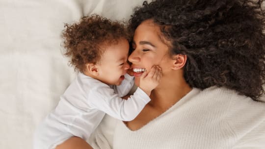 Breastfeeding woman in nursery
