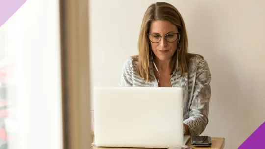 A self-employed professional working at a computer