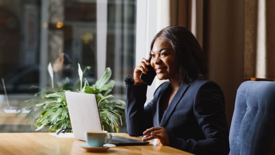 woman talking on the phone at work
