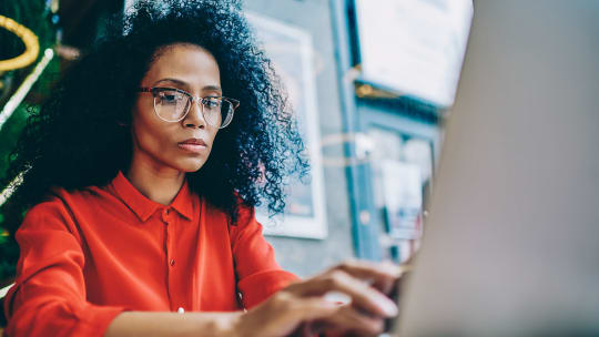 Woman typing on computer