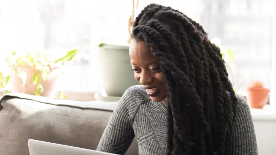 woman typing on laptop