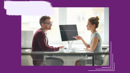 two people having a conversation at work