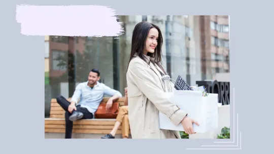A woman smiling and holding a box. 